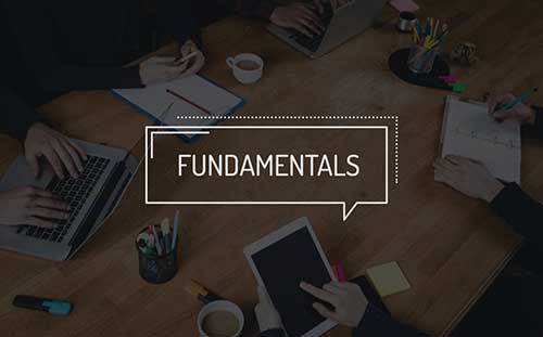 image of individuals in business at a table with text overlay reading "fundamentals"