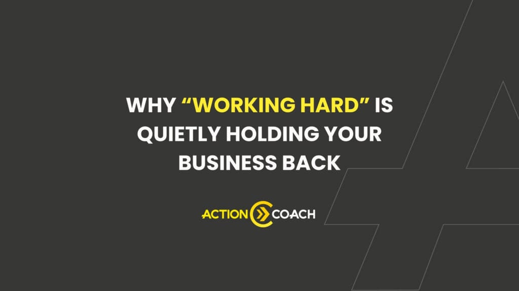 White and yellow text on a dark background reads: Why WORKING HARD is quietly holding your business back—discover the true ROI meaning with expert guidance. The Action Coach logo is below the text.