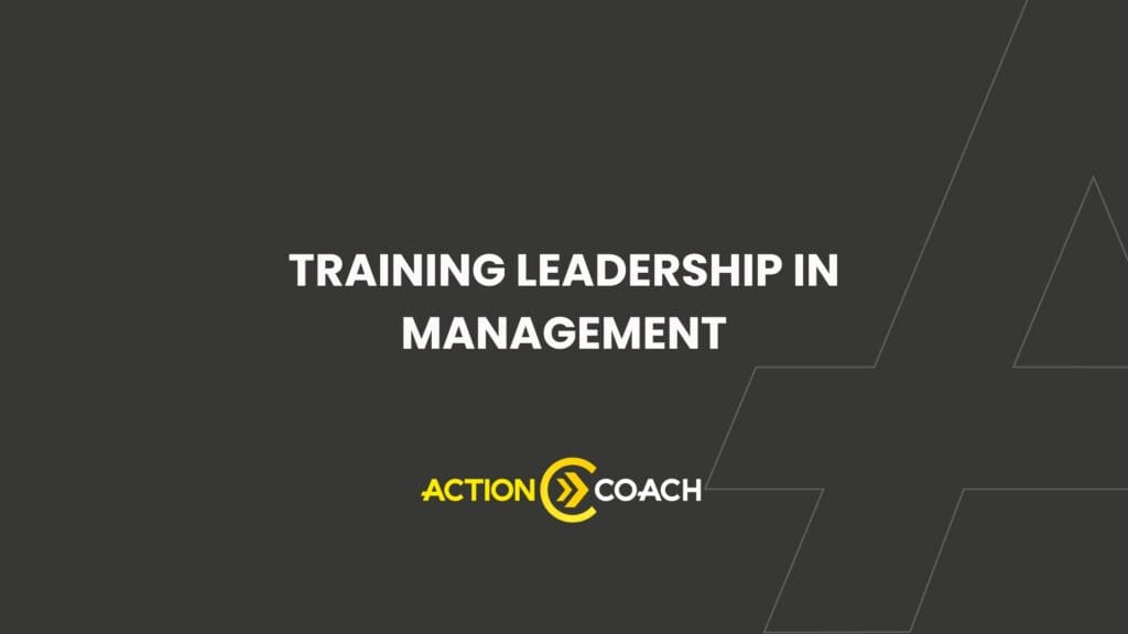 Dark gray slide with the text Training Leadership in Management in white, highlighting Business Coaching, and the yellow and white ActionCOACH logo at the bottom. Thin geometric lines are faintly visible on the right.